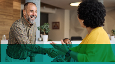 Two individuals shaking hands